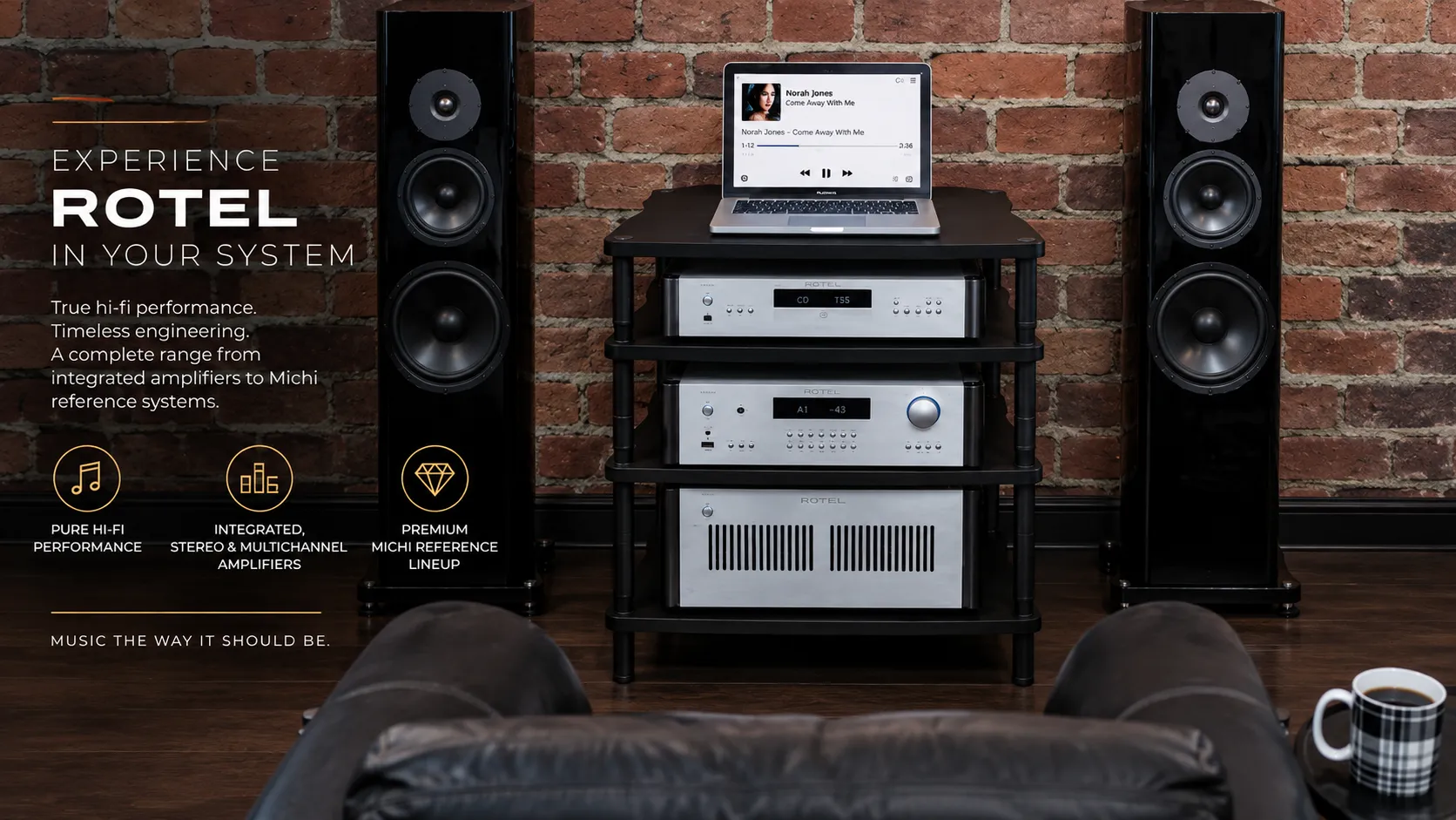 Rotel hi-fi audio system with stereo amplifiers and premium speakers in a luxury listening room.